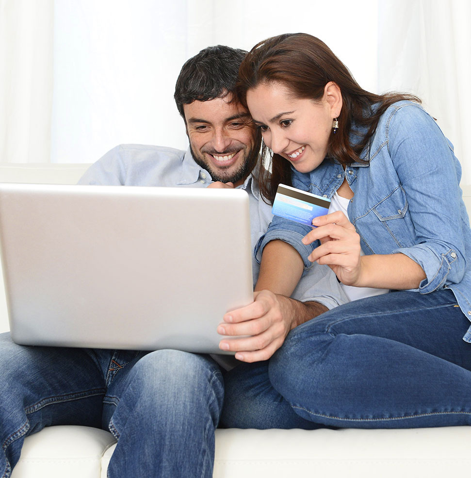 Couple with credit card on laptop