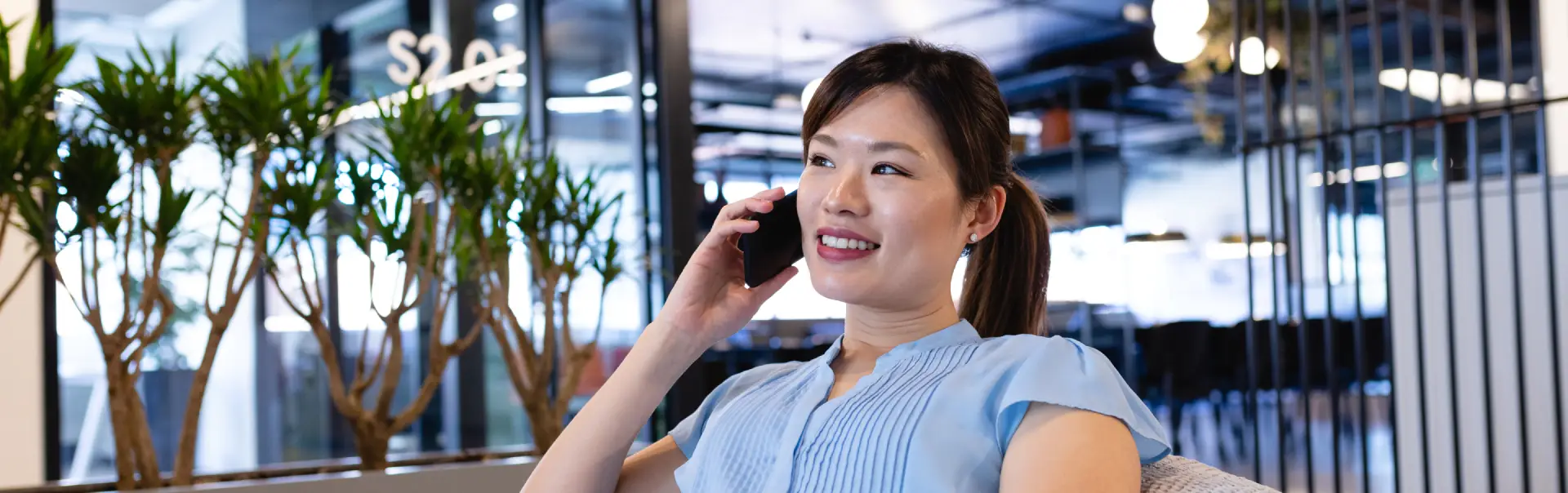 asian woman having a phone call in a bean bag 2025 04 03 15 37 37 utc
